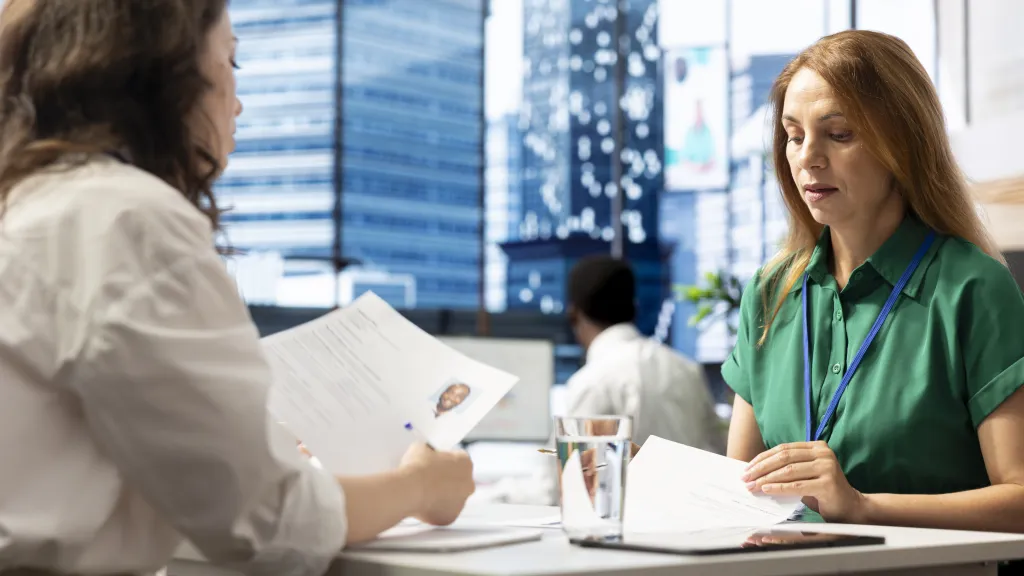 Hiring manager going over a job offer with a candidate